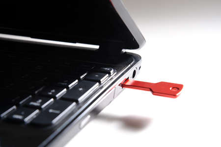 red usb key on black keyboardの写真素材
