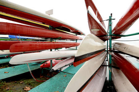 Colorful Kayaks and canoes in a Row stackの写真素材