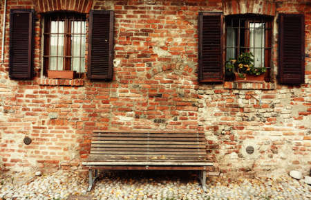 external view of old bench in italian farrmhouseの写真素材