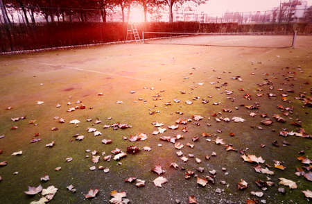 empty tennis court in autumnの写真素材