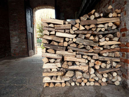 piles of fire wood in old farm