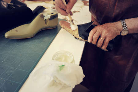 craftsman making luxury handmade man shoes