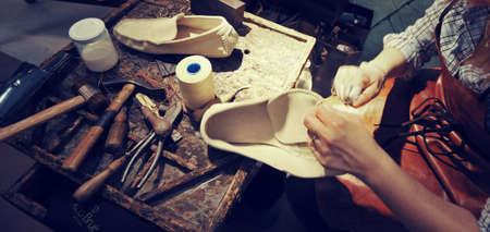 craftsman making luxury handmade man shoesの写真素材