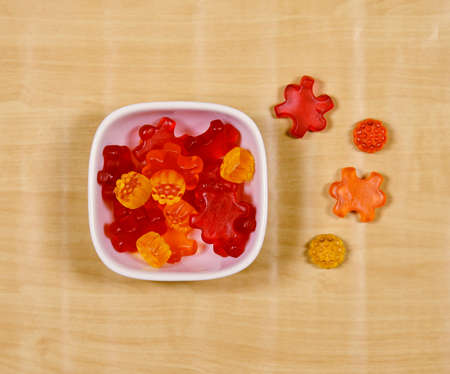Gummy Bear Candy Colorful Background on woodの写真素材