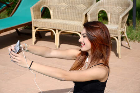 beautiful young woman making selfie
