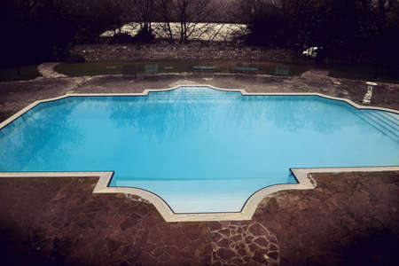 sad view of retro style swmming pool in winterのeditorial素材