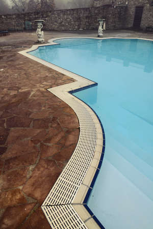 sad view of retro style swmming pool in winterのeditorial素材