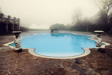 sad view of retro style swmming pool in winterのeditorial素材