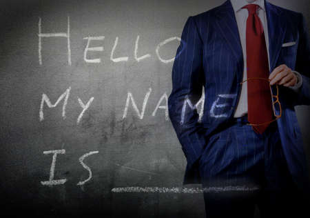 Self Introduction - Hello, My name is ... written on a blackboard with businessmanの写真素材