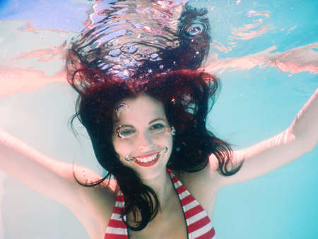 happy beautiful woman portrait smile underwater