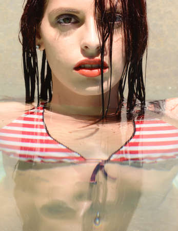 beautiful happy woman portrait in  the pool