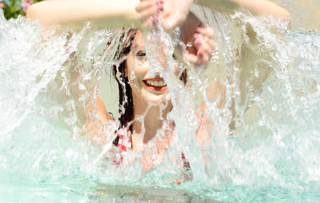 beautiful happy woman portrait in  the pool