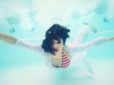 beautiful woman portrait underwaterの写真素材