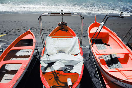 colorful fishing wooden boat moored on the beach