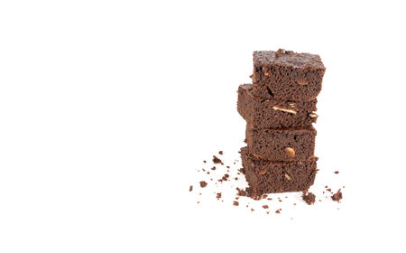 Pile of brownies isolated on whiteの写真素材