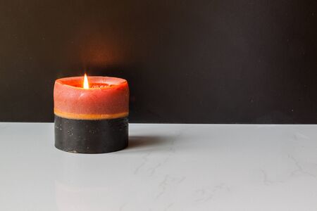 single spa candle light on stone tileの写真素材