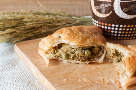 fresh meat pie and string bean on wood boardの写真素材