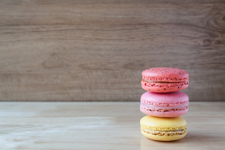 macarons three flavors on wood background