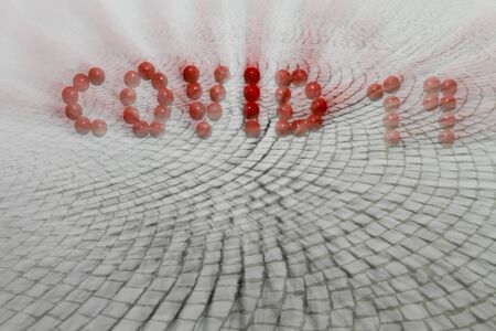 Covid written with pillsの写真素材