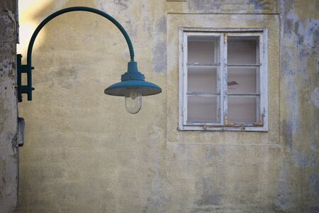 Lantern and window in old town centerの写真素材