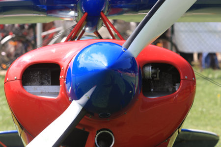 Close up of the propeller of a vintage airplane with blue propeller