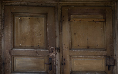 Old wooden door with iron handle, detail of an old door, grunge backgroundの写真素材