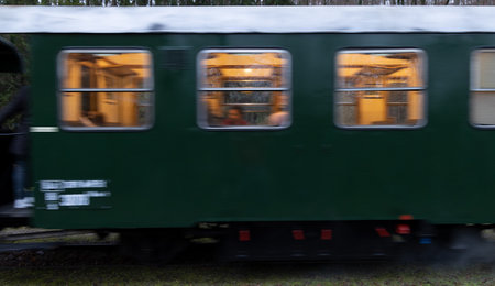 Passenger train in motion on the railway. Blurred motion.
