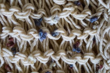 Closeup. Wool knitted fabric. Wool textiles. Colorful Wool. Background.Large binding needles.の写真素材