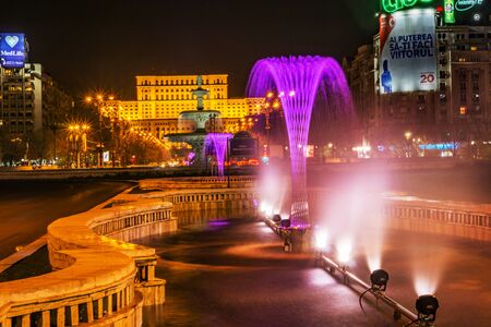 Bucharest, Romania - 01.04.2017  night trails and the building of the People House, Romanian Parliament.のeditorial素材