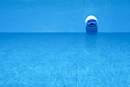 Chemical Dispenser Connected to the Filter Pump for Uniform Sequential Distribution of Chlorine throughout the Pool. Copy space. Minimalism.の写真素材