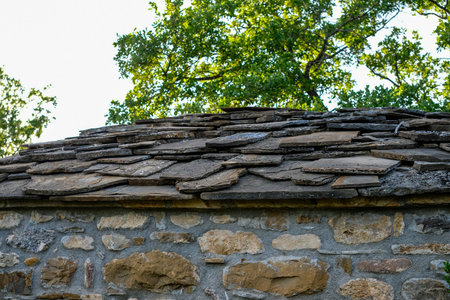 Slate or stone slabs on the roof of a Catalan chapel. Roof of rock.の写真素材