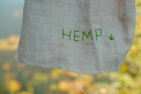 Hemp Cloth on a Blurred Background of a River or Lake. Demand for Natural Everyday Items.