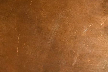 The classic copper surface for design is slightly illuminated on the right side. Common defects on a...
