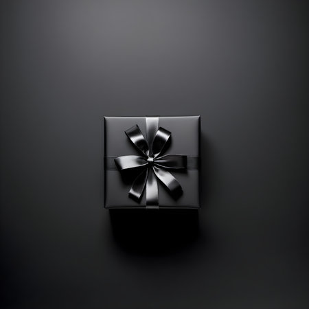 Black gift box with silver bow on black background. 3d renderingの素材