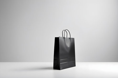 Black shopping bag on white background. 3d rendering. Mock up.の素材