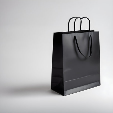Black shopping bag isolated on a white background. 3d rendering.の素材