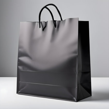 Black shopping bag isolated on grey background. 3d rendering. Mock up.の素材