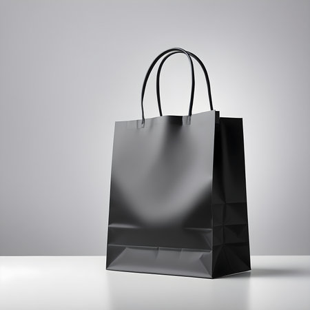 Black shopping bag isolated on white background. 3d rendering. Mock up.の素材