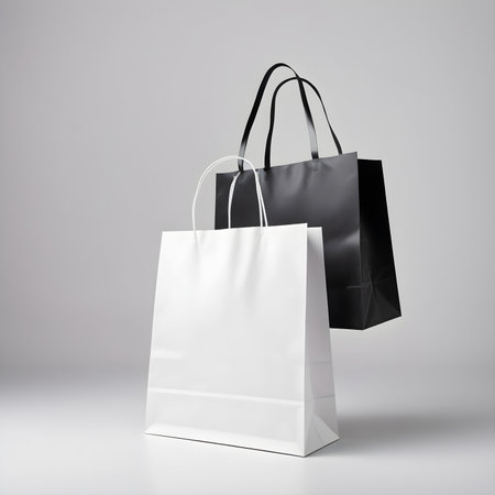 Black and white paper shopping bags isolated on white background. 3d renderingの素材