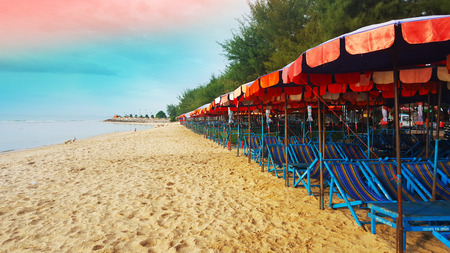 AUGUST 3, 2018:  Silhouette beach chair and umbrella on the morning beach, Beautiful sea view background at Cha-am, Thailandのeditorial素材