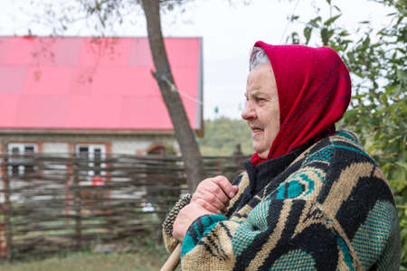 Elderly woman in the villageの写真素材