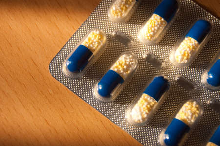 many capsules isolated on background