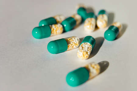 many capsules isolated on backgroundの写真素材