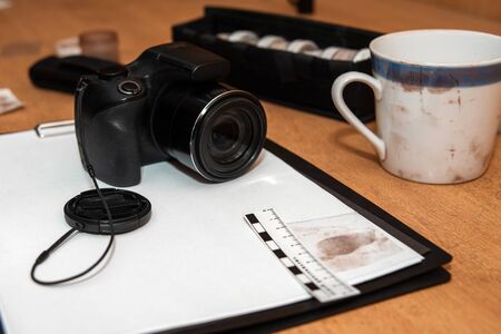 set of devices for taking fingerprints from objects at the crime scene. Forensic-medical examination. camera and a mug in paint. Prints. Detective servicesの写真素材