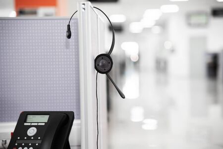 operator workplace with computer and headphone in a call center. work as an assistant in working with applications. anonymous helpの写真素材