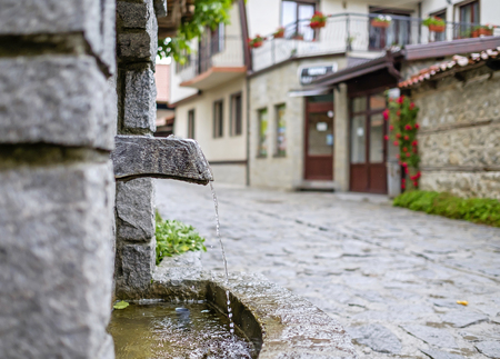 Old water source on the old town street in Bansko, Bulgaria 1の写真素材