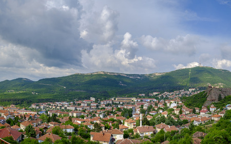 Panorama of a city in the mountains on a background of a cloudy sky 2の写真素材