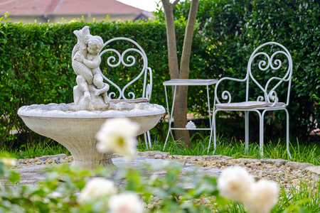 A place to relax with benches in the gardenの写真素材