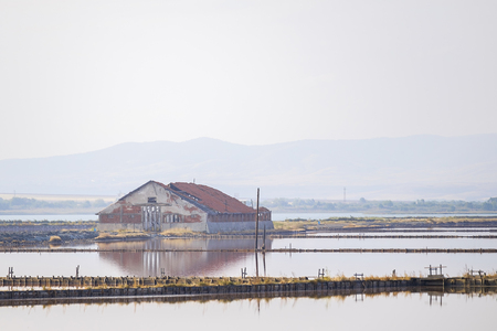 Old abandoned vintage house on salty lake 1の写真素材