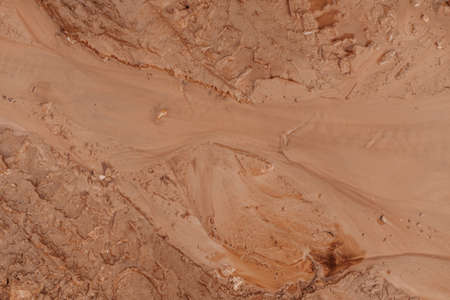 incredibly beautiful brown sand texture. sandy background. brown background. river bottomの写真素材